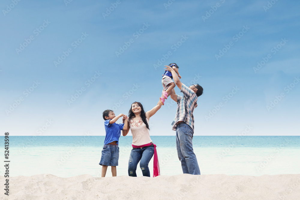 Asian family at white sand beach Asian family at white sand beach