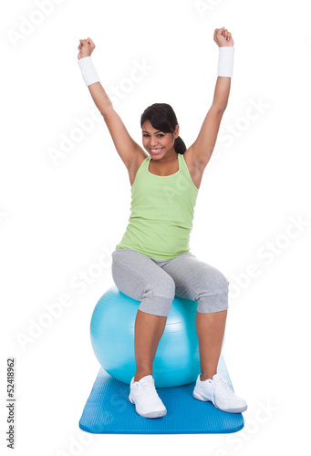 Woman Exercising On Pilates Ball