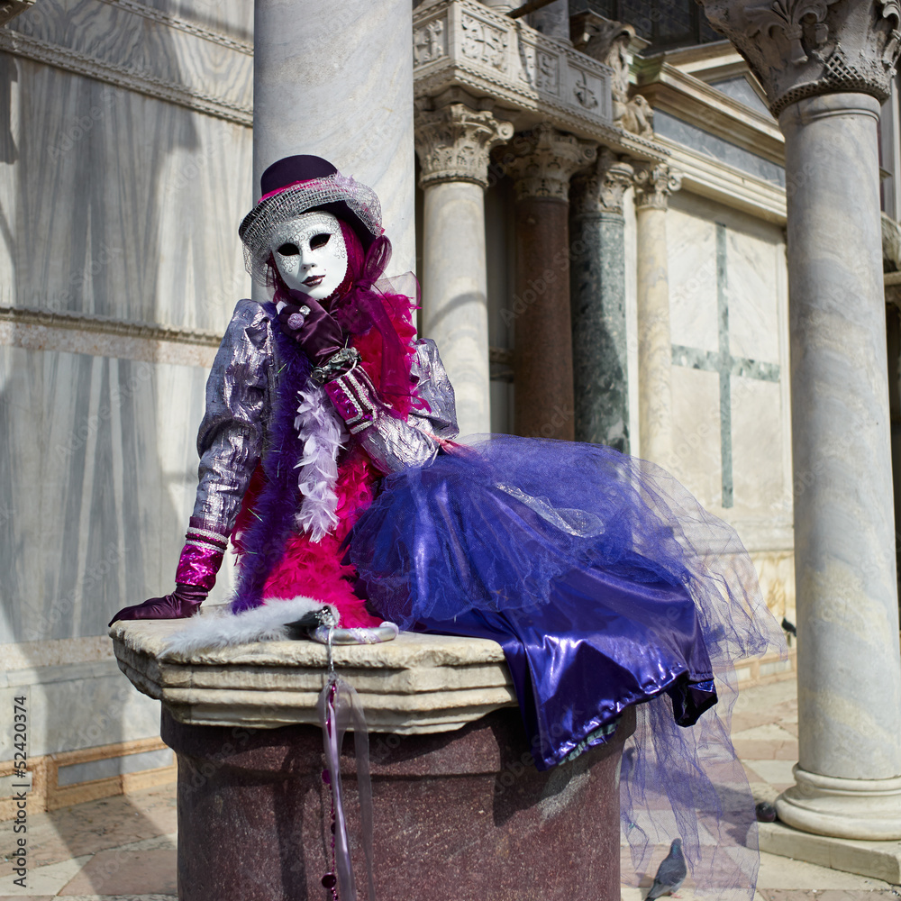 Venetian costume attends Carnival of Venice.
