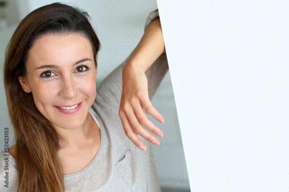 Relaxed young woman standing at home Relaxed young woman standing at home