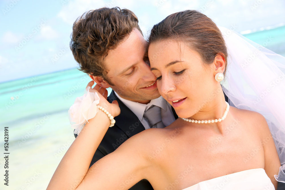 Couple celebrating wedding on the beach Couple celebrating wedding on the beach