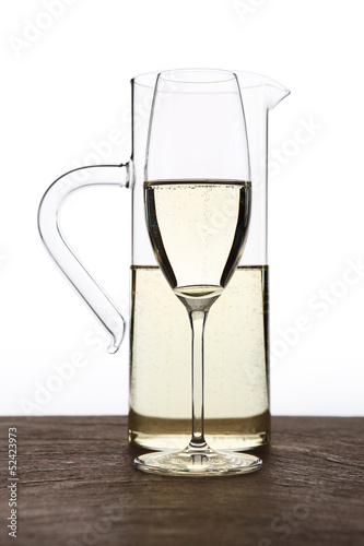 carafe of white wine with glass