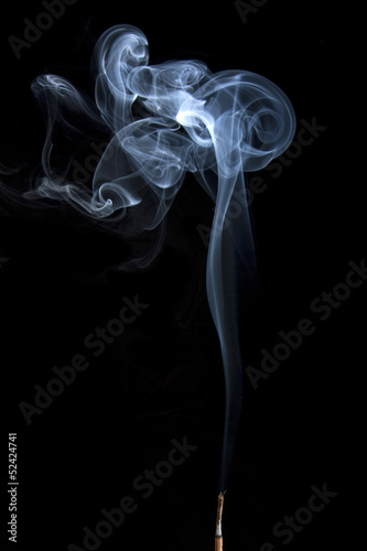 Burning incense stick with smoke