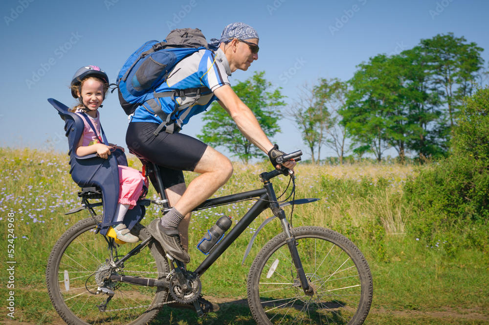 family cycling in summer