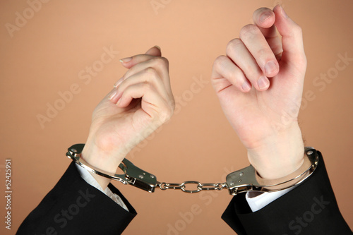 Photos Man and woman hands and breaking handcuffs on color background