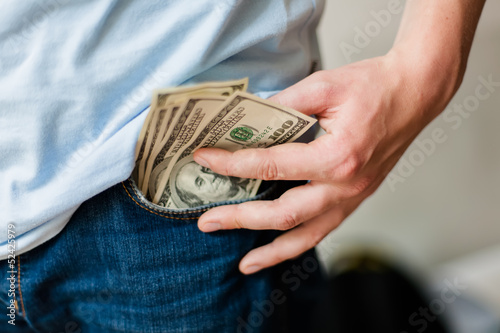 Man holding American dollars in hands