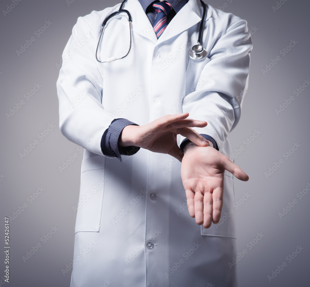 young doctor measures the heart rate itself young doctor measures the heart rate itself