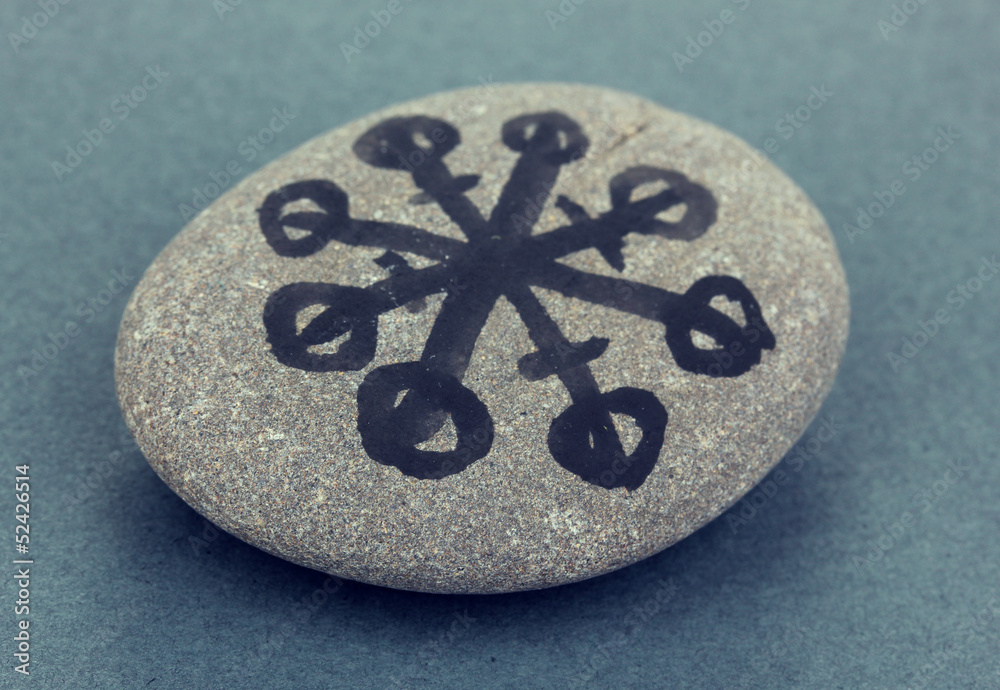 Fortune telling with symbols on stone on grey background Fortune telling with symbols on stone on grey background