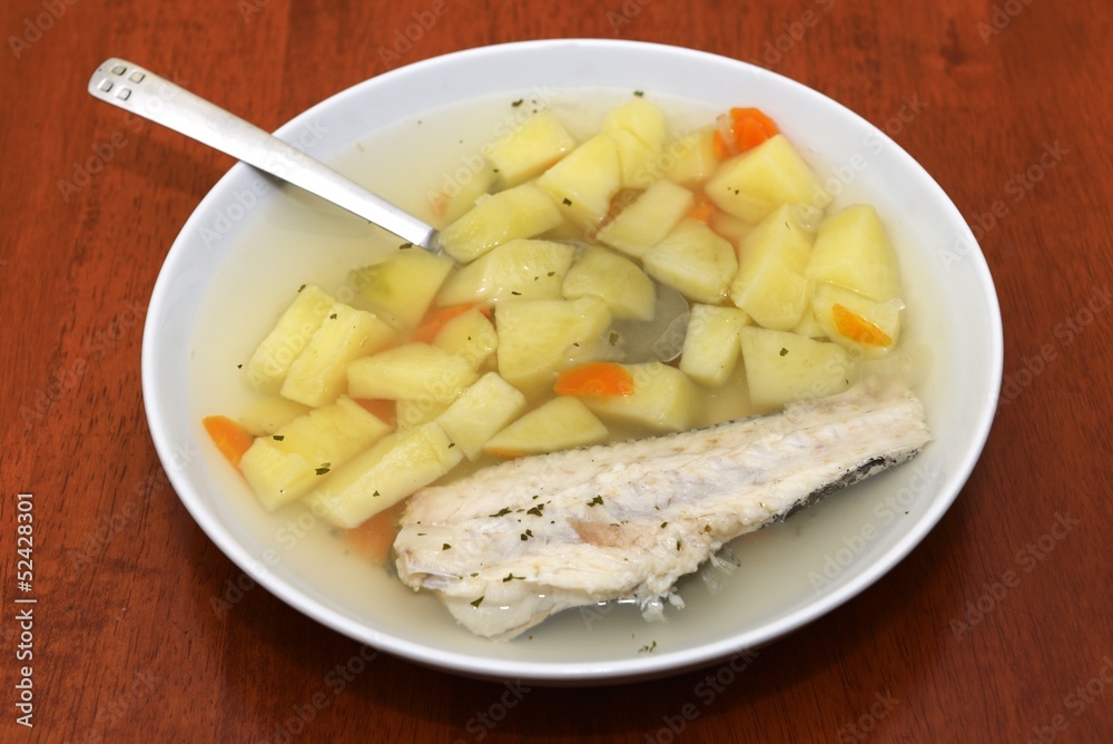 Fish soup on a wooden table background Fish soup on a wooden table background