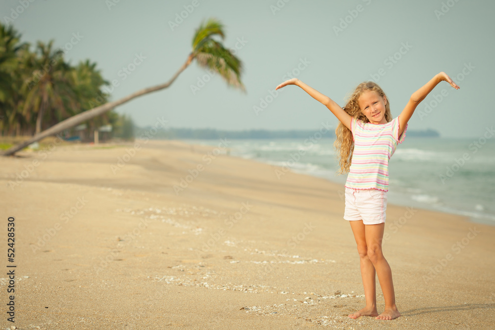 Adorable happy smiling girl on beach vacation Adorable happy smiling girl on beach vacation