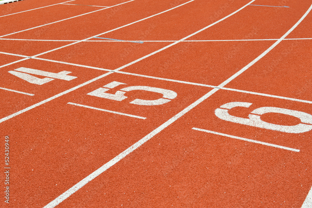 numbers on running tracks of outdoor athletic stadium