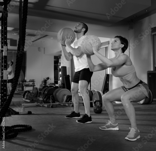 Crossfit ball fitness workout group woman and man