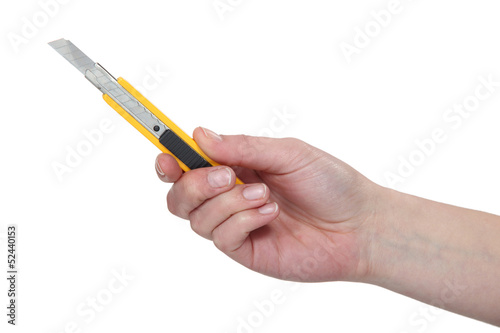 Hand holding a utility blade