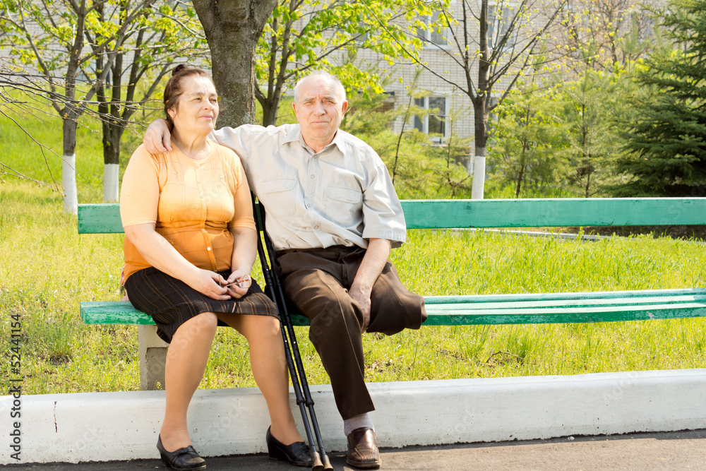 Elderly couple on a park bench
