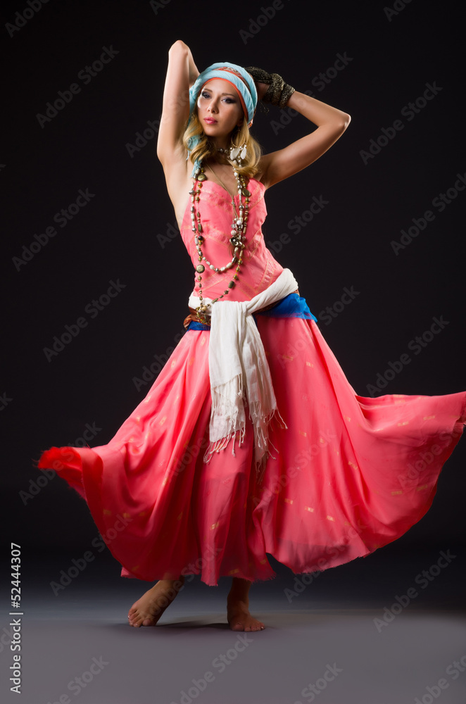 Fototapeta premium Woman dancing spanish dances on white