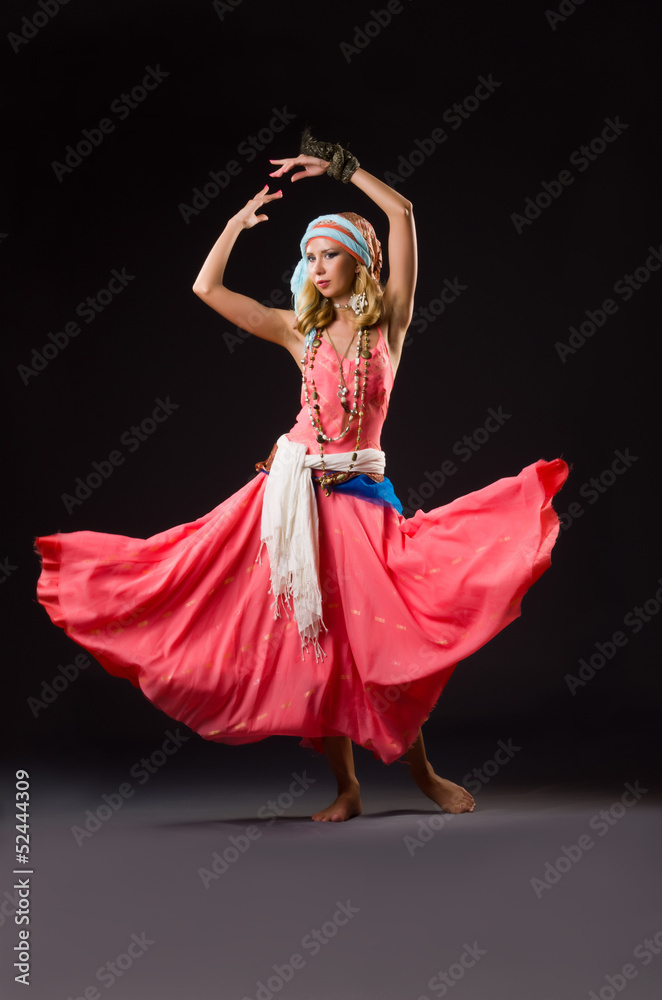 Fototapeta premium Woman dancing spanish dances on white