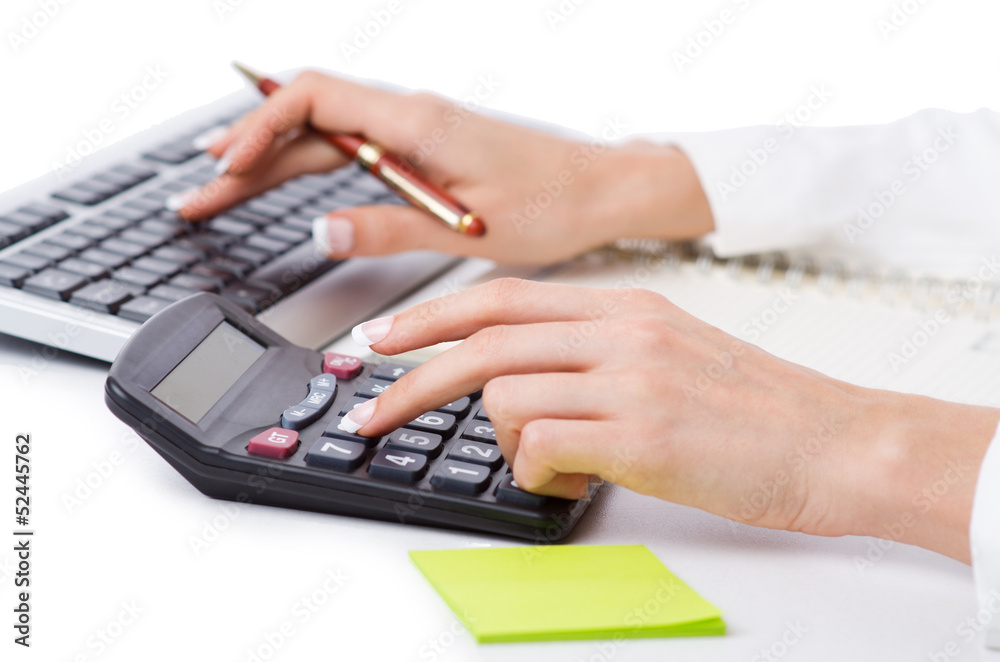 Hands working on the calculator Hands working on the calculator