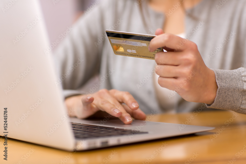 close-up woman's hands holding a credit card close-up woman's hands holding a credit card
