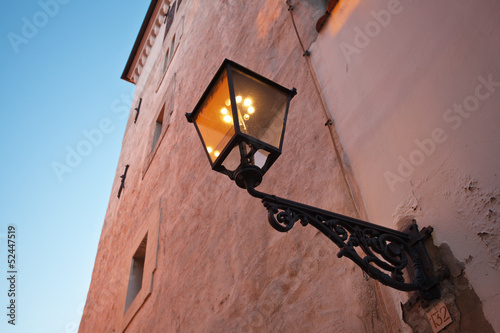 фотографія old gas lamp on the wall in Zagreb. Croatia.