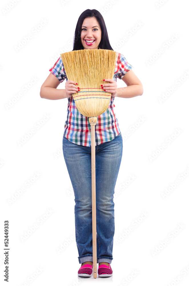 Young woman with broom isolated on white
