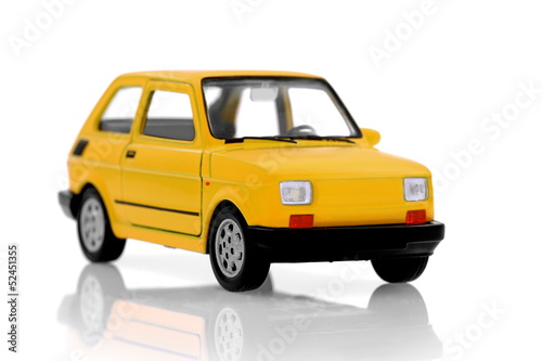 Cult small yellow compact city car on white
