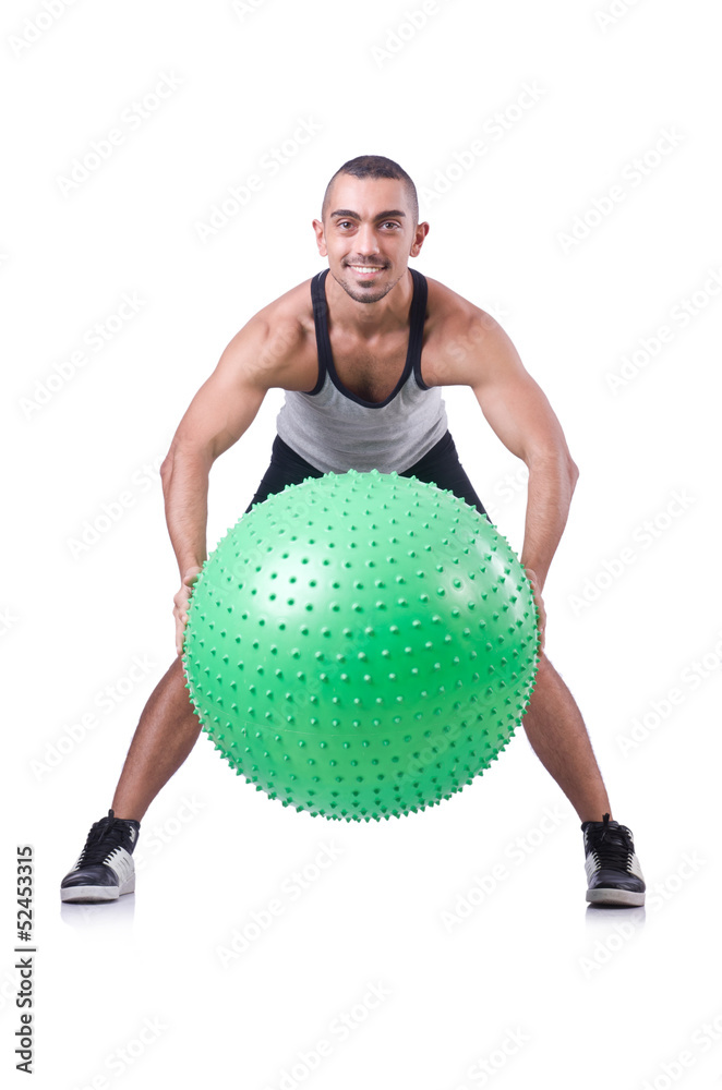 Man with swiss ball doing exercises on white Man with swiss ball doing exercises on white