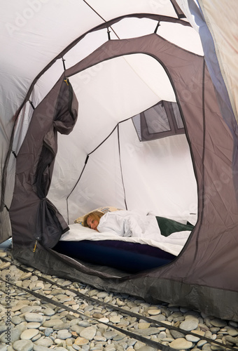 Girl sleeping in a tent