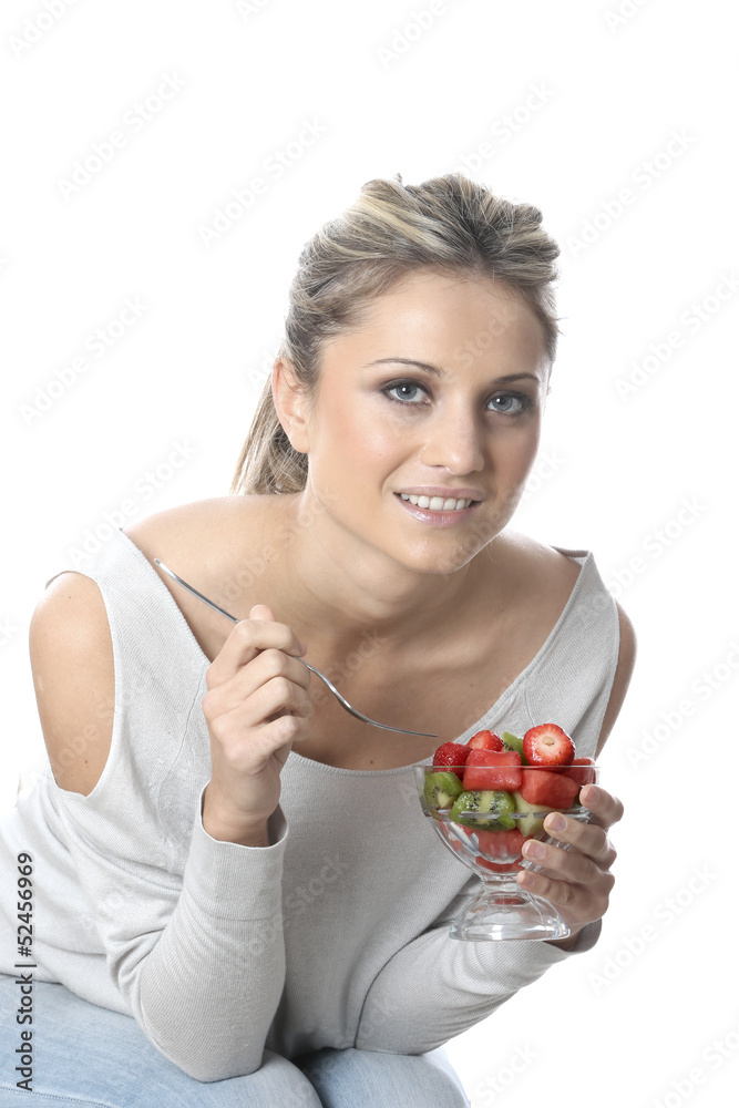 Model Released. Young Woman Eating Fresh Fruit Salad Model Released. Young Woman Eating Fresh Fruit Salad