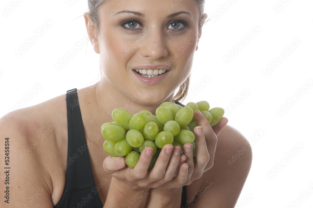 Model Released. Young Woman Holding a Bunch of Grapes Model Released. Young Woman Holding a Bunch of Grapes