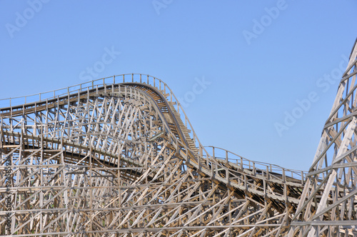 Close view on the construction of a large wooden rollercoaster