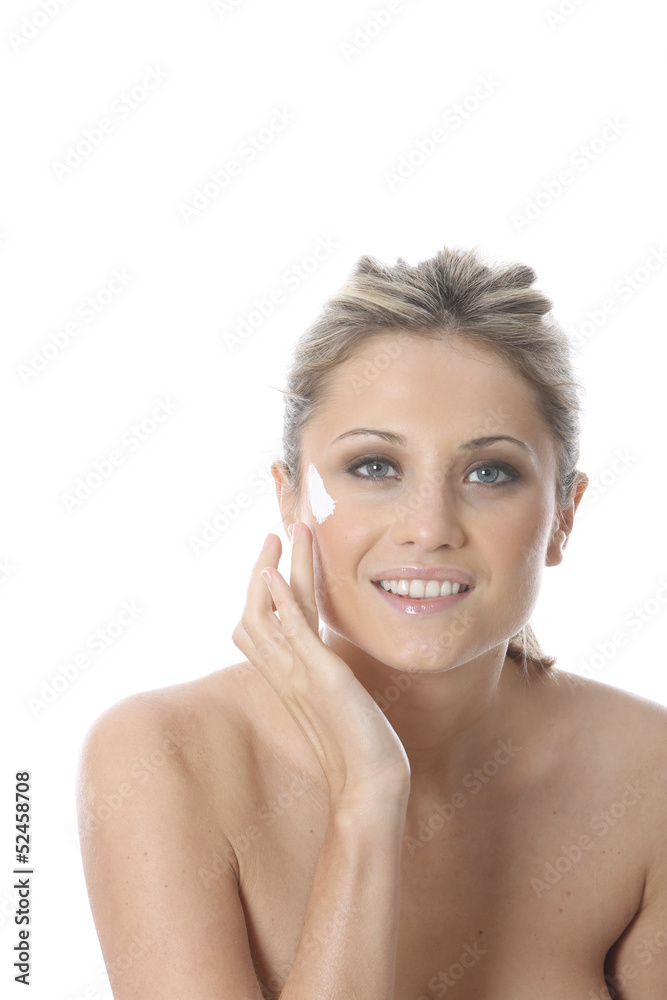 Model Released. Young Woman Applying Cream