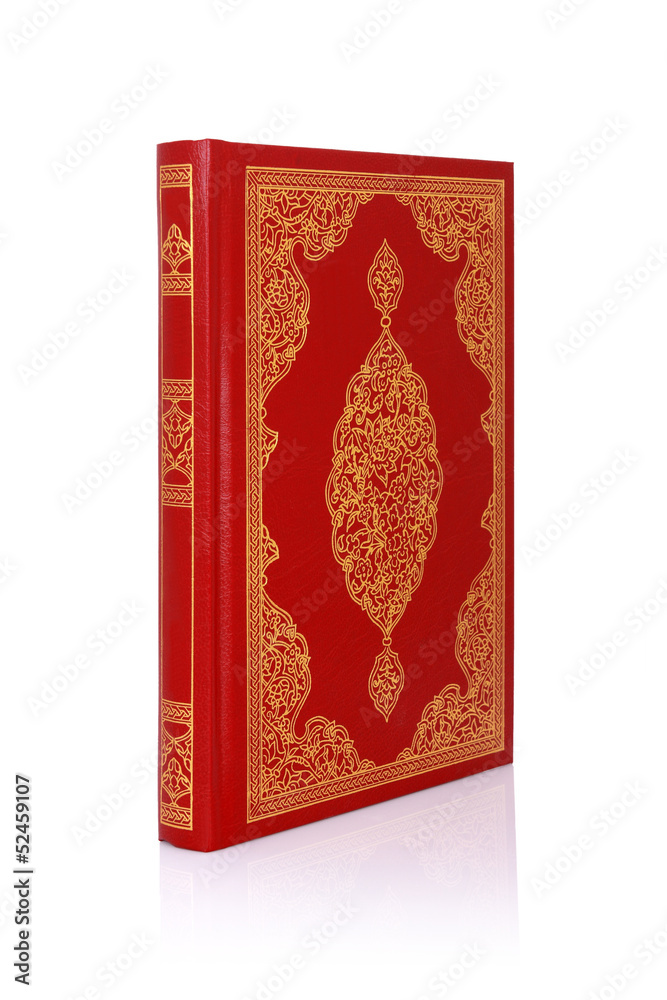 Fototapeta premium Old red book with gold color ornament on cover isolated on white
