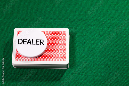 Fotografie Poker cards with dealer chip