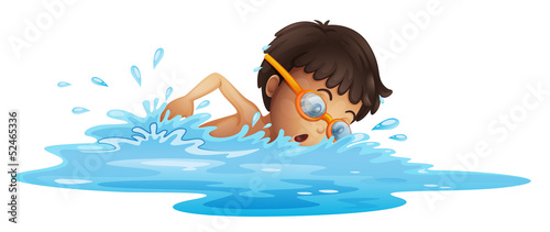 A young boy swimming with a yellow goggles