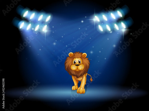A lion at the center of the stage with spotlights
