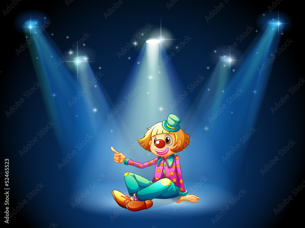 Fototapeta premium A stage with a female clown sitting at the center