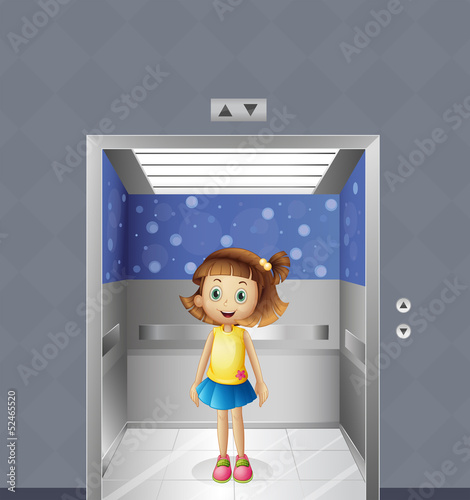 A pretty young girl inside the elevator