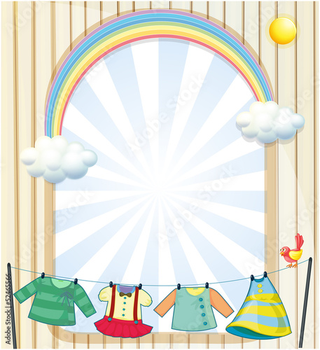 Clothes hanging under the sun near an entrance