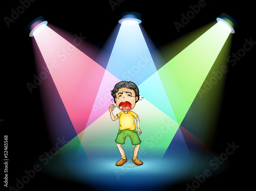 A boy crying at the stage