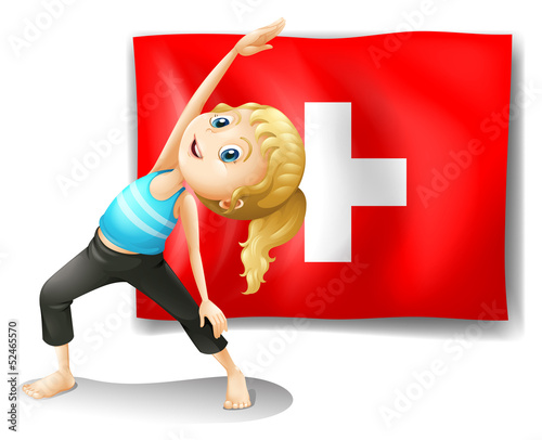A girl having her exercise in front of the Switzerland flag