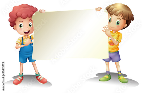 Two young boys holding an empty signage