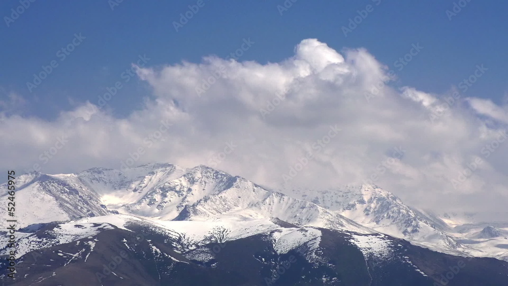 Mountain peaks in the clouds. Time-laps 30X Mountain peaks in the clouds. Time-laps 30X
