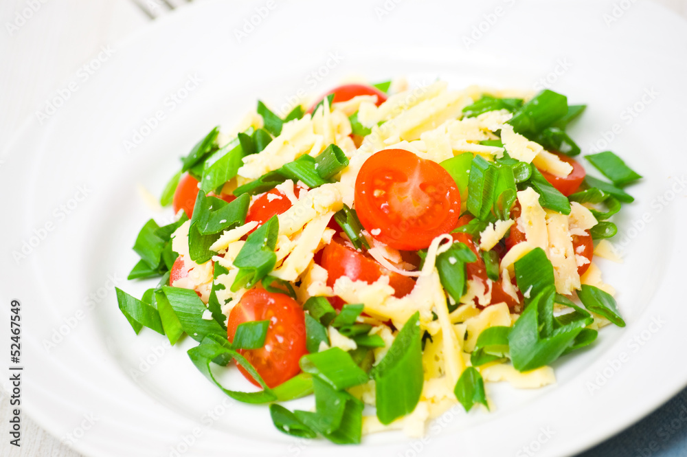 Fresh vegetable salad with cherry tomatoes, green onions, cheese Fresh vegetable salad with cherry tomatoes, green onions, cheese