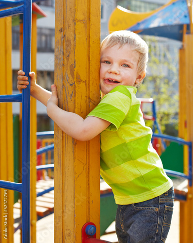 Little boy is playing on playground