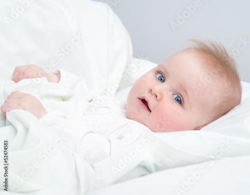 baby lying in the bed