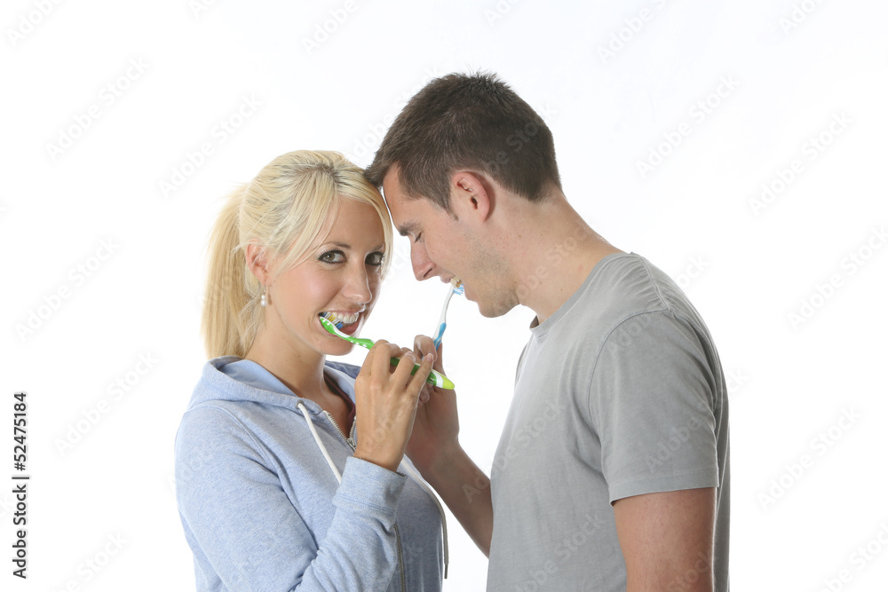 Model Released. Young Couple Brushing Teeth Model Released. Young Couple Brushing Teeth