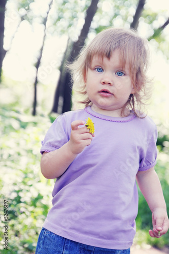 Little girl with dandelion