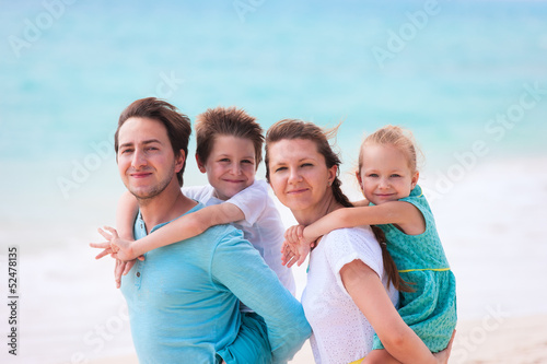 Family on a tropical beach vacation © BlueOrange Studio