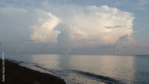 timelapse of huge cumulus clouds over ocean