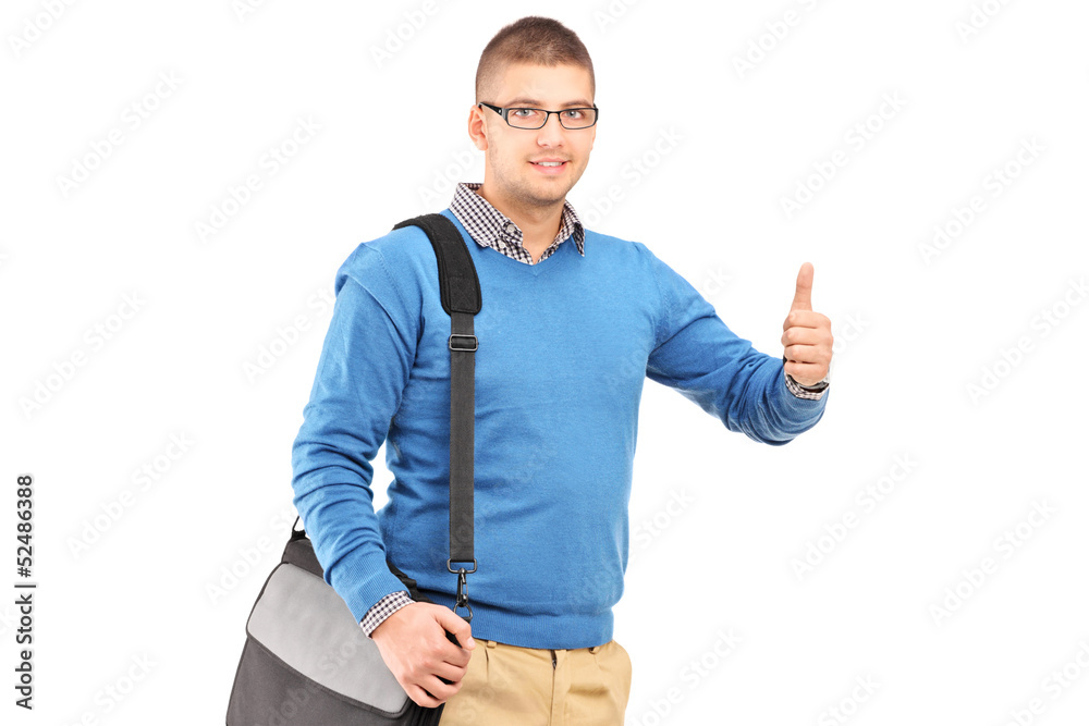 Young man with a shoulder bag giving a thumb up Young man with a shoulder bag giving a thumb up